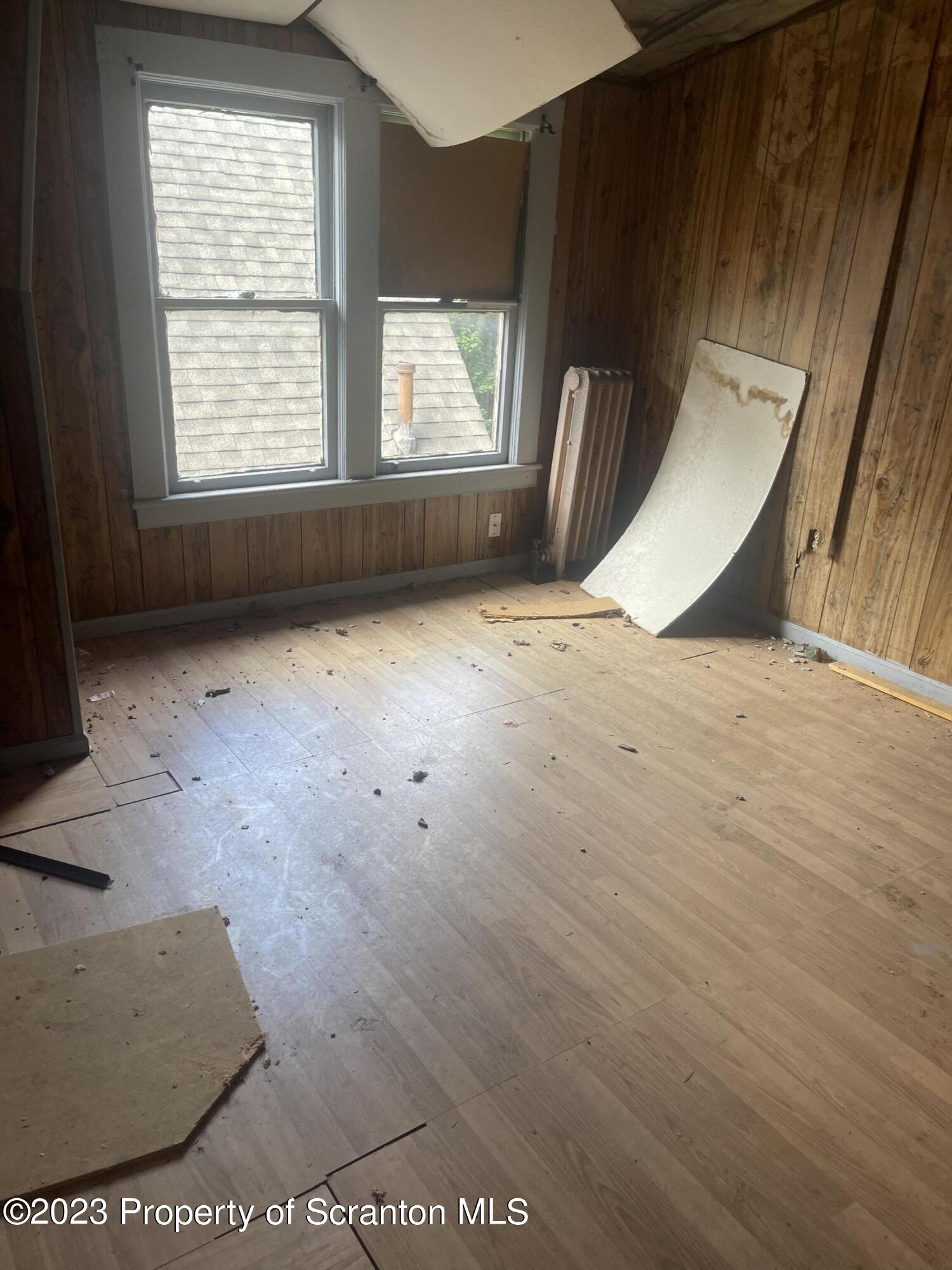 831 Monroe Avenue Scranton, PA 18510 - Photo 2 of 35 an empty room with windows