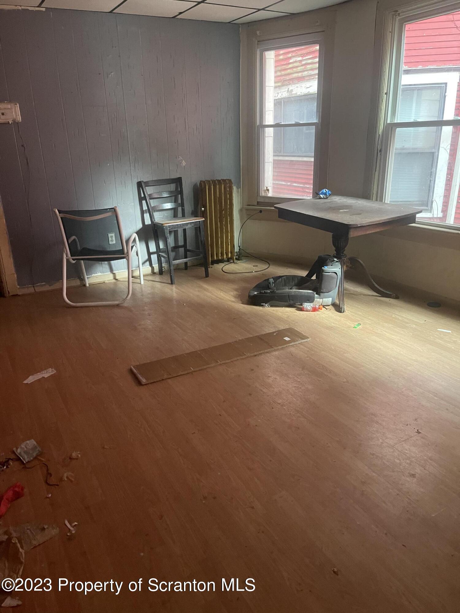831 Monroe Avenue Scranton, PA 18510 - Photo 26 of 35 a room with furniture and window