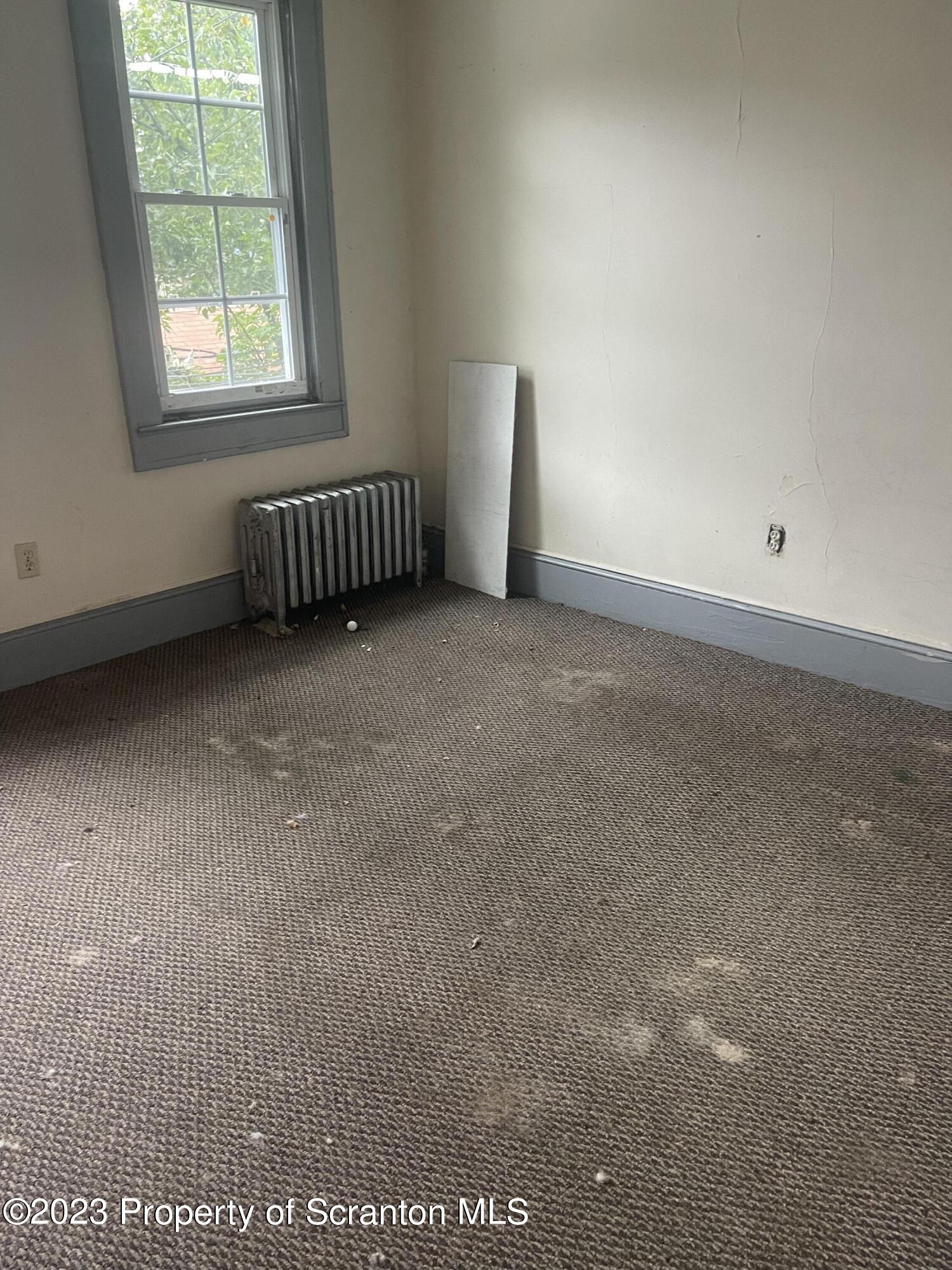 831 Monroe Avenue Scranton, PA 18510 - Photo 35 of 35 an empty room with a window