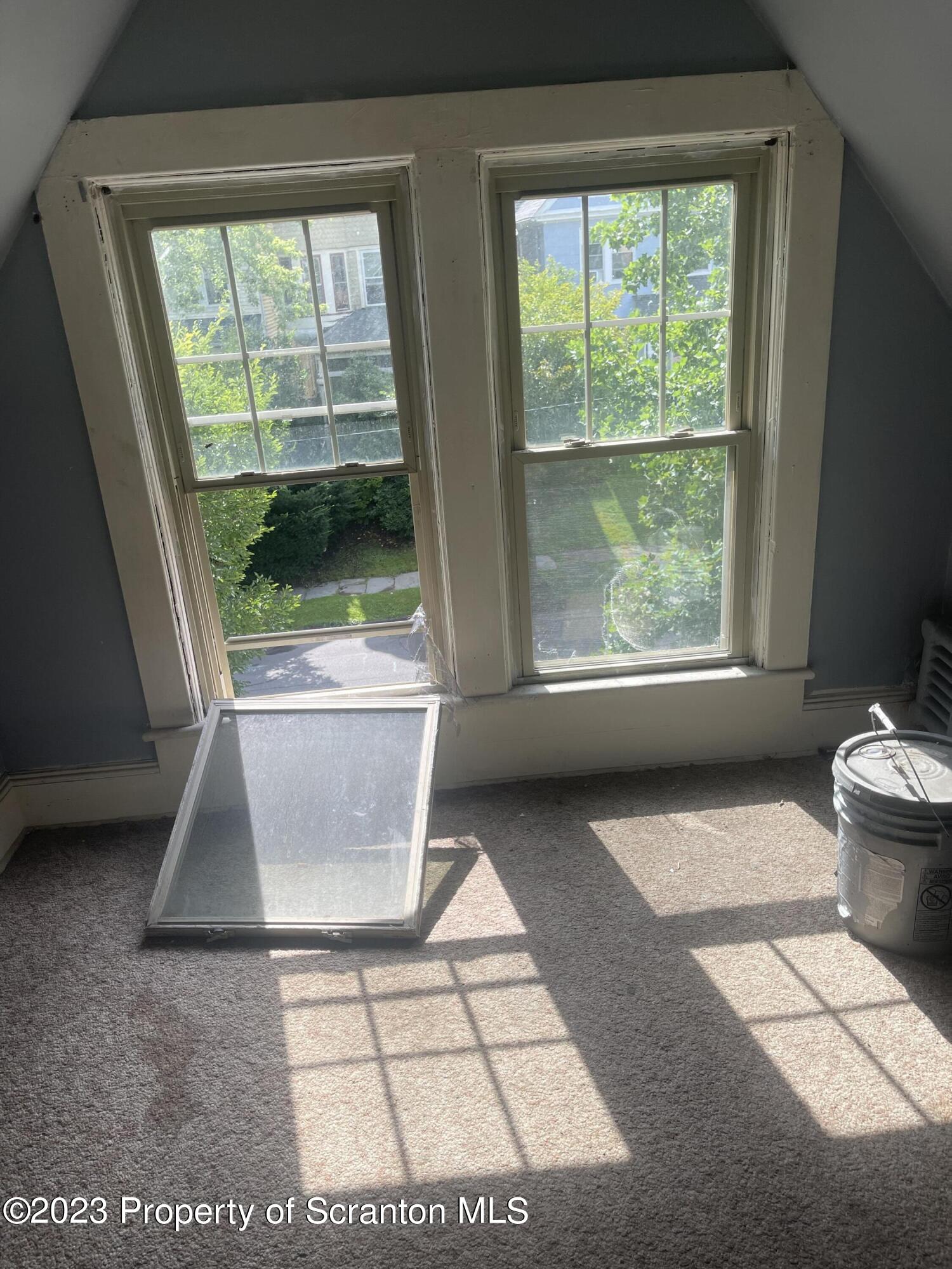 831 Monroe Avenue Scranton, PA 18510 - Photo 6 of 35 a view of an empty room with a window
