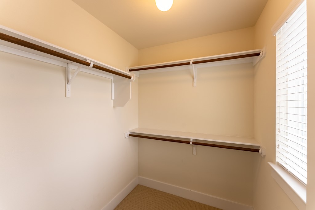 13008 Armaga Springs Road Austin, TX 78727 - Photo 25 of 33 Walk in closet with light colored carpet