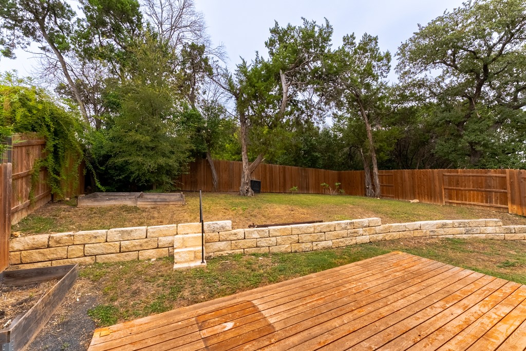 13008 Armaga Springs Road Austin, TX 78727 - Photo 30 of 33 Wooden deck featuring a fenced backyard