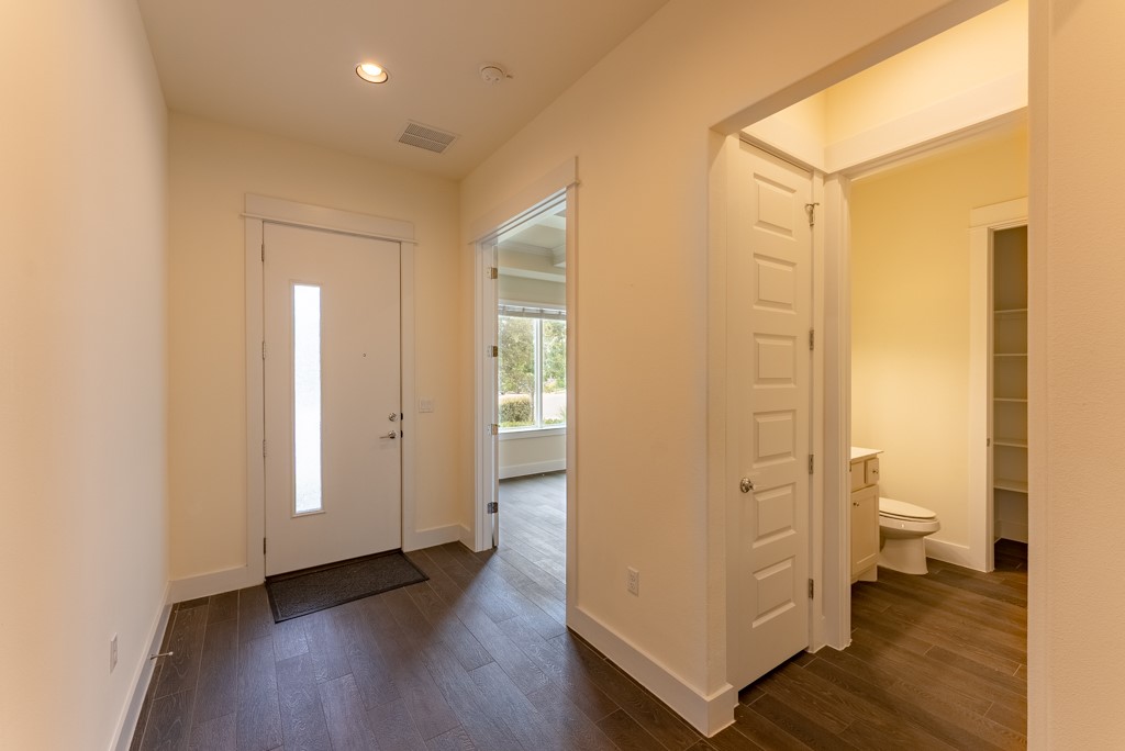 13008 Armaga Springs Road Austin, TX 78727 - Photo 5 of 33 Foyer featuring dark wood finished floors and recessed lighting