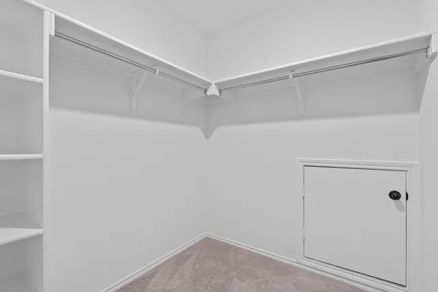 a view of an empty walk in closet