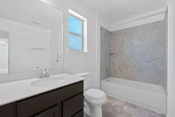 a bathroom with a sink a toilet and a bathtub