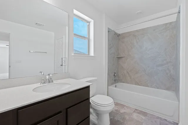 a bathroom with a sink a toilet and a bathtub