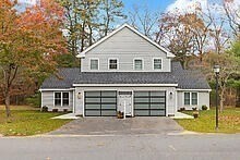 1 Barracks Road, Unit 1 Hudson, MA 01749 - Photo 21 of 29 a front view of a house with a yard and garage