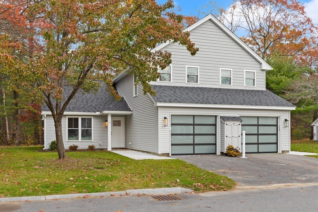 1 Barracks Road, Unit 1 Hudson, MA 01749 - Photo 28 of 29 a front view of a house with a yard