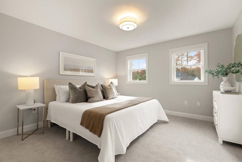 1 Barracks Road, Unit 1 Hudson, MA 01749 - Photo 8 of 29 a bedroom with a bed and window