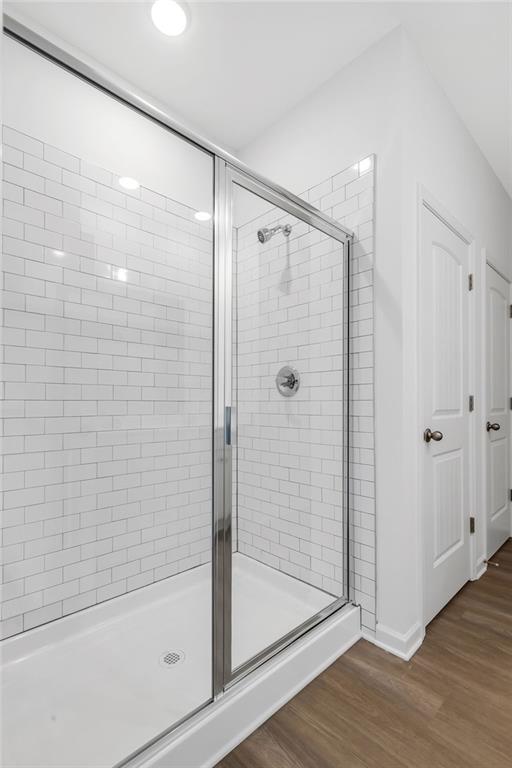 172 Sweet Water Lane Southeast Rome, GA 30161 - Photo 17 of 29 a bathroom with a glass shower door