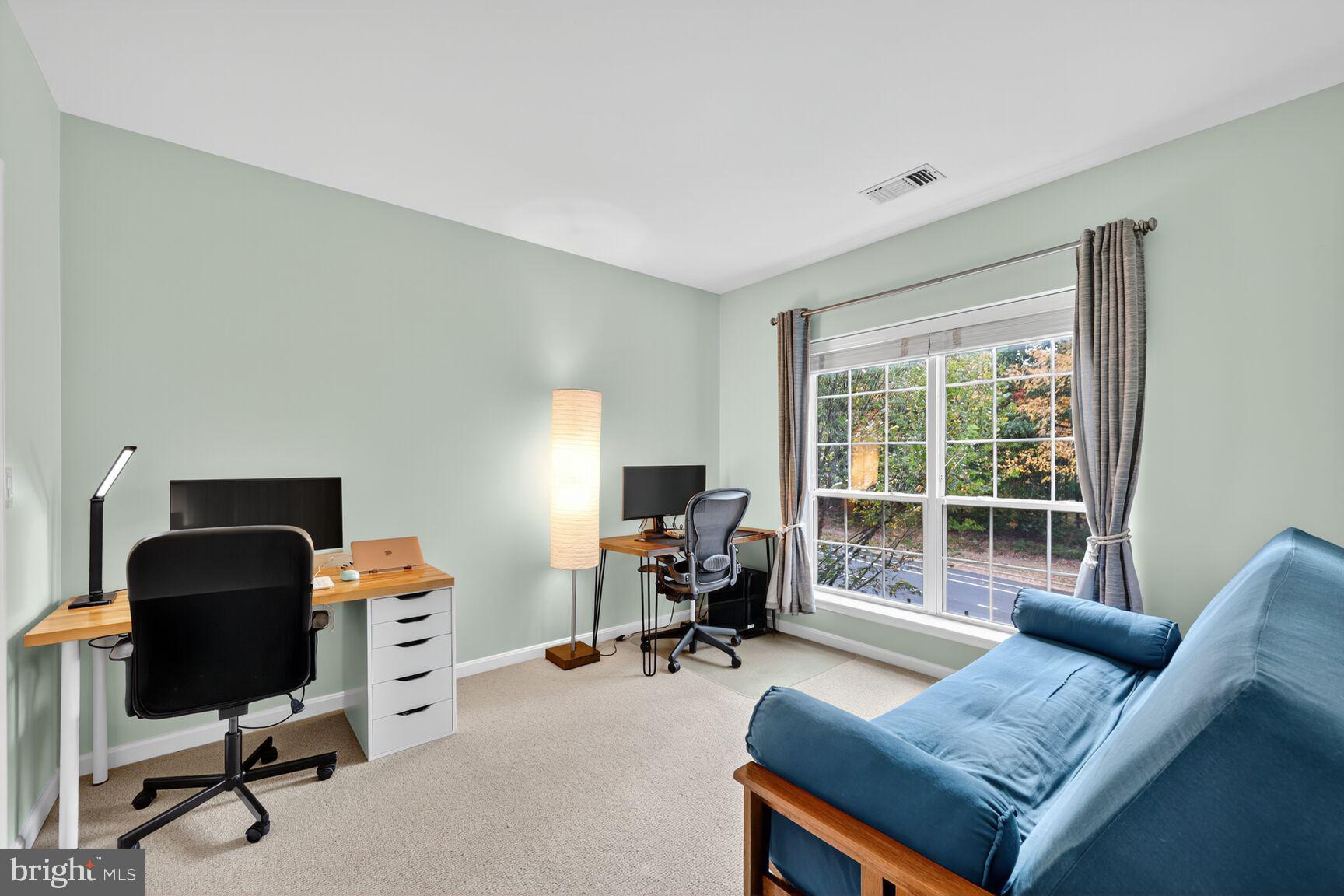 4561 Strutfield Lane, Unit 3211 Alexandria, VA 22311 - Photo 11 of 14 a livingroom with workspace and a couch
