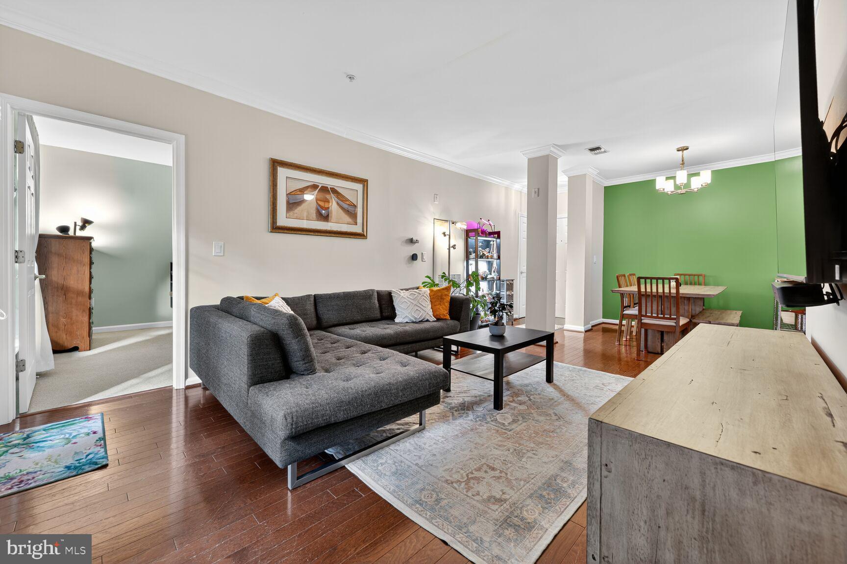 4561 Strutfield Lane, Unit 3211 Alexandria, VA 22311 - Photo 3 of 14 a living room with furniture and a flat screen tv