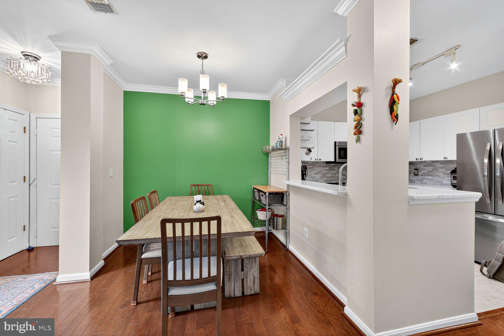 4561 Strutfield Lane, Unit 3211 Alexandria, VA 22311 - Photo 6 of 14 a view of kitchen with furniture and wooden floor