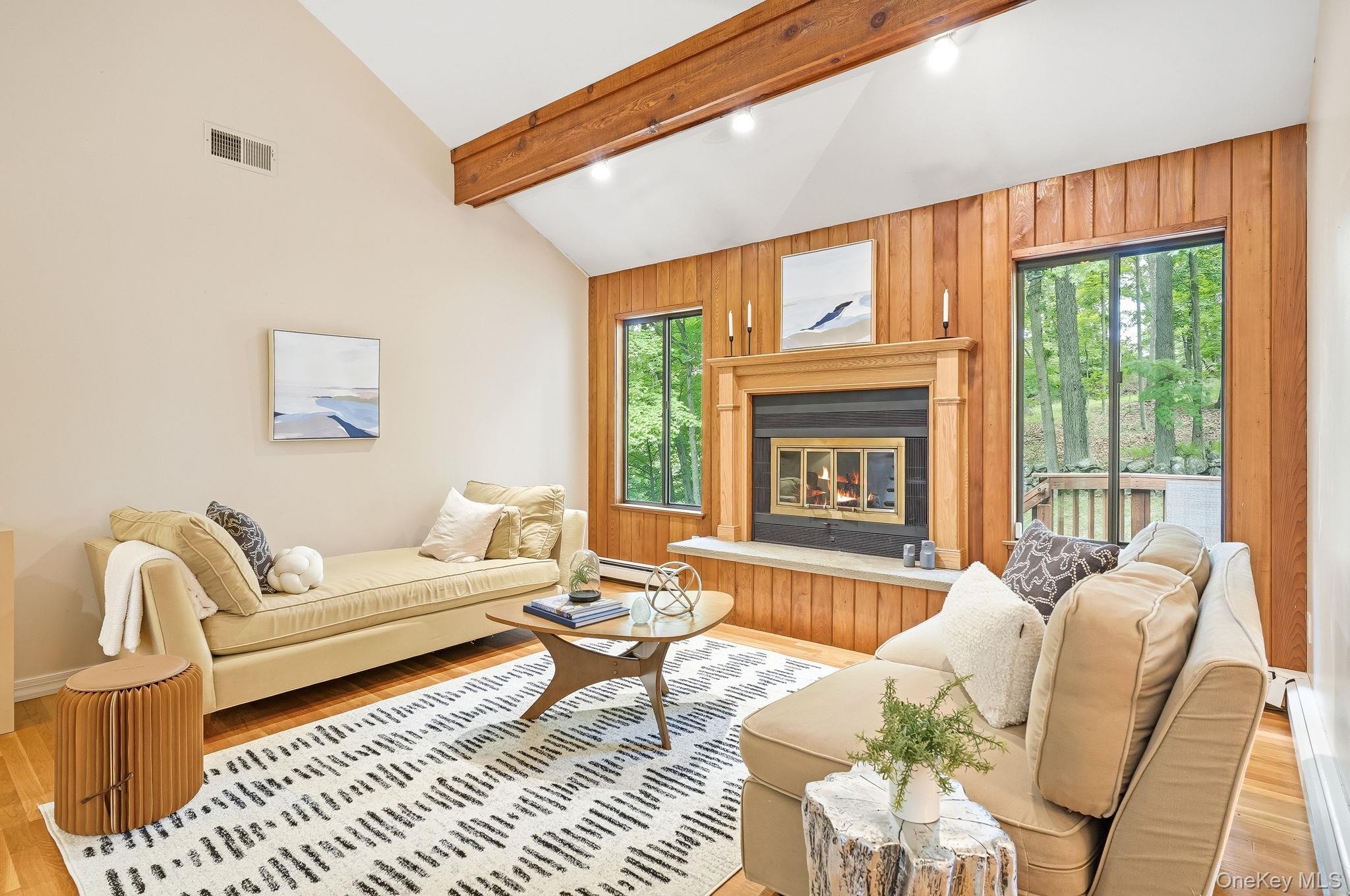 43 Powder Horn Road Cortlandt Manor, NY 10567 - Photo 7 of 35 The living room features a vaulted ceiling with exposed wood beams and recessed lighting