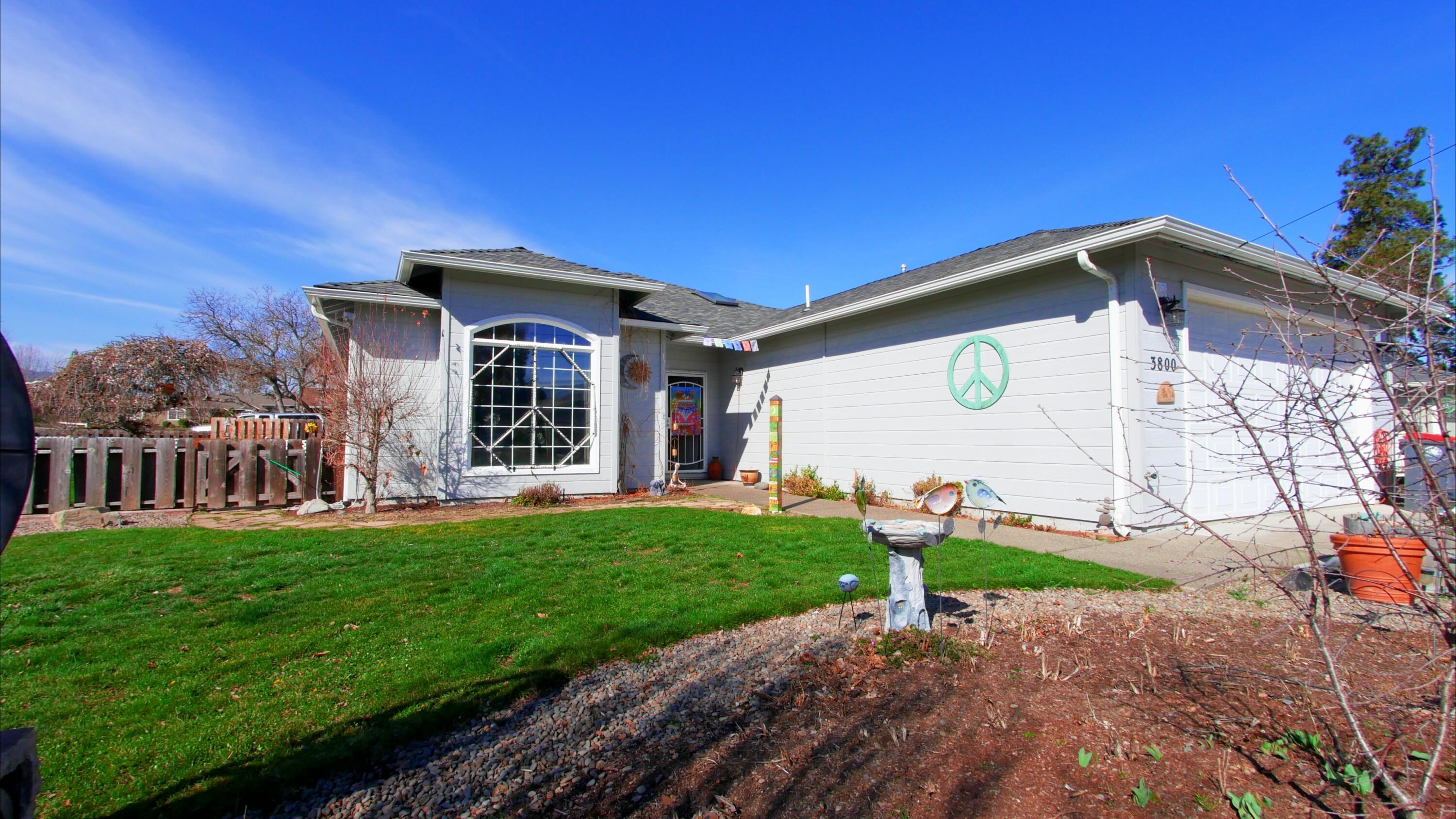 3800 Hilsinger Road Phoenix, OR 97535 - Photo 5 of 30 a front view of a house with a yard and garage