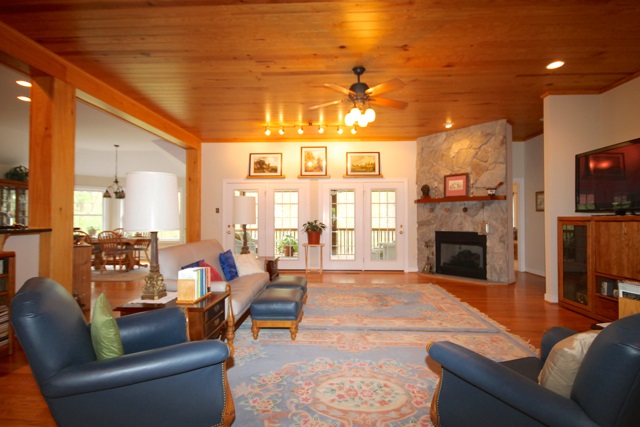 4031 Venable Road Kents Store, VA 23084 - Photo 11 of 47 a living room with furniture a fireplace and a flat screen tv