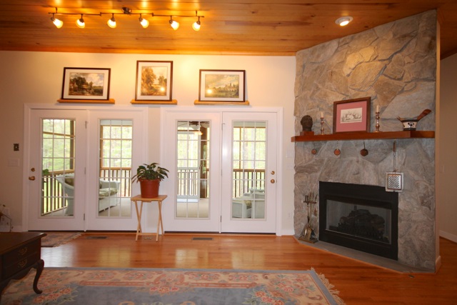 4031 Venable Road Kents Store, VA 23084 - Photo 12 of 47 a view of an empty room with wooden floor and a fireplace