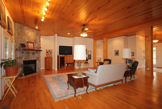 4031 Venable Road Kents Store, VA 23084 - Photo 14 of 47 a living room with furniture a fireplace and a flat screen tv