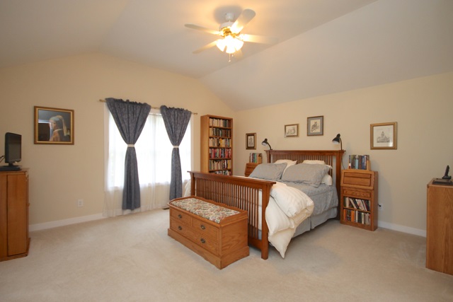 4031 Venable Road Kents Store, VA 23084 - Photo 22 of 47 a bed room with a bed and a chandelier