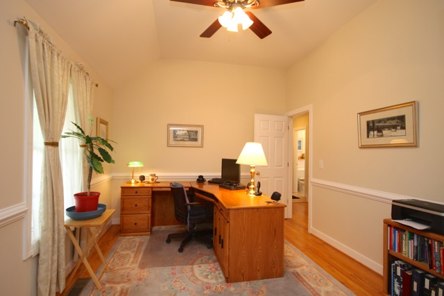 4031 Venable Road Kents Store, VA 23084 - Photo 26 of 47 a view of a workspace with furniture and a book shelf