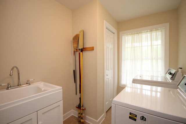 4031 Venable Road Kents Store, VA 23084 - Photo 31 of 47 a bathroom with a sink and a large mirror