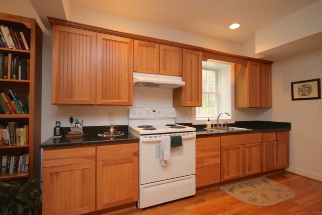 4031 Venable Road Kents Store, VA 23084 - Photo 34 of 47 a kitchen with stainless steel appliances granite countertop a stove a sink and a microwave