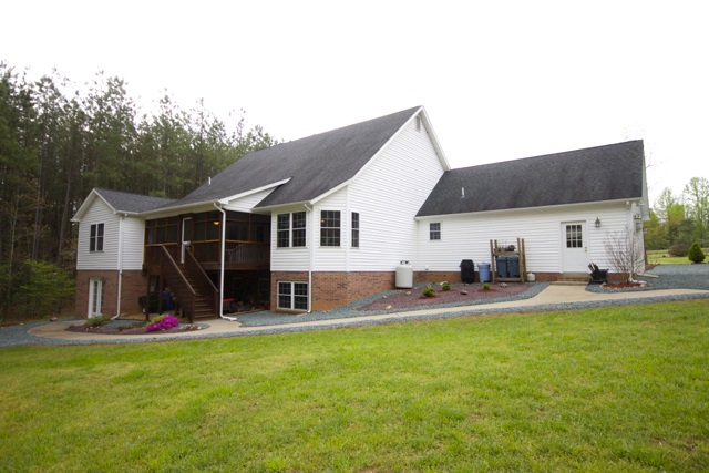 4031 Venable Road Kents Store, VA 23084 - Photo 42 of 47 a view of a house with backyard and sitting area