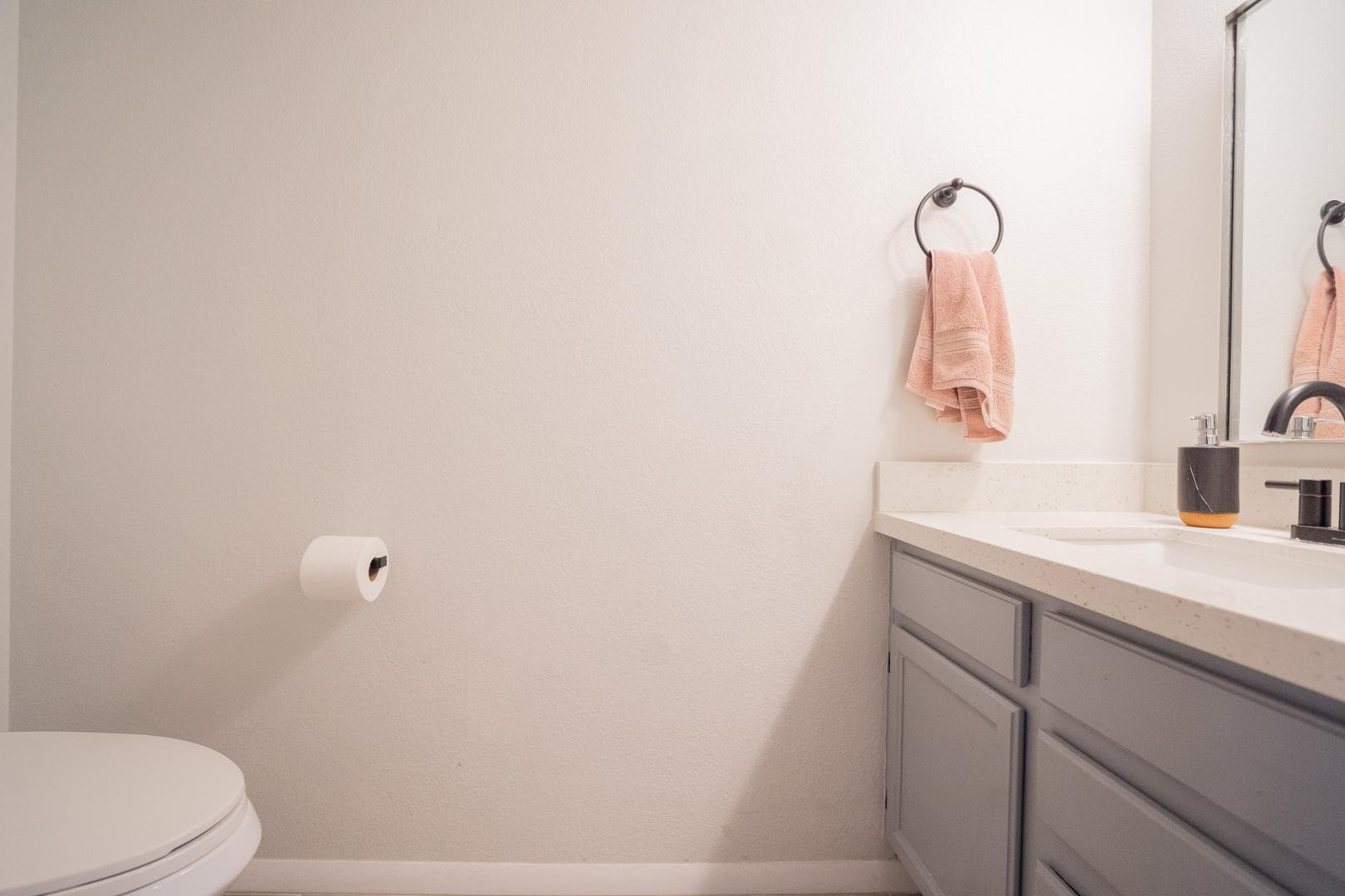 8111 West Wacker Road, Unit 70 Peoria, AZ 85381 - Photo 12 of 38 a bathroom with a sink a toilet and mirror