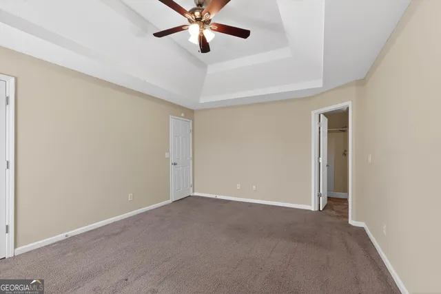 a view of wooden floor and windows in a room