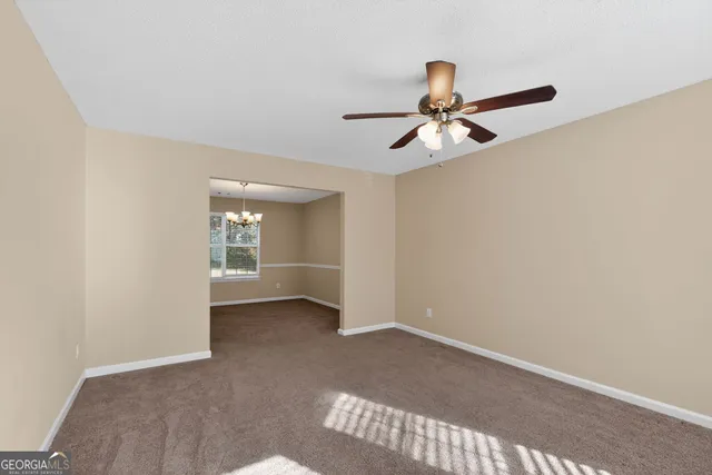 a kitchen with granite countertop a sink and a stove top oven