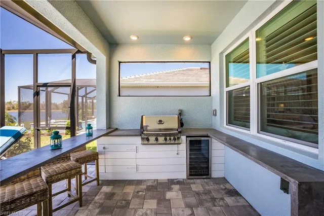 a kitchen view with a stove and a window