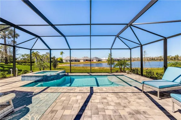 a view of a swimming pool with a patio