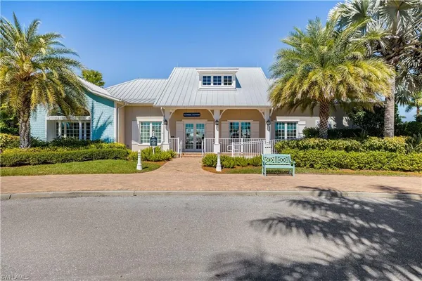 a view of a house with outdoor space and palm trees