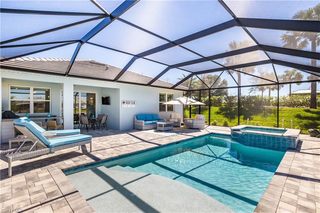 14471 Stillwater Way Naples, FL 34114 - Photo 2 of 20 a view of a backyard with swimming pool
