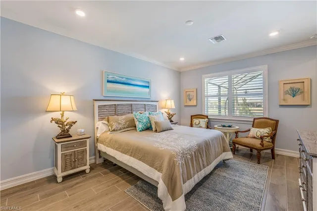 a bedroom with a bed and a lamp