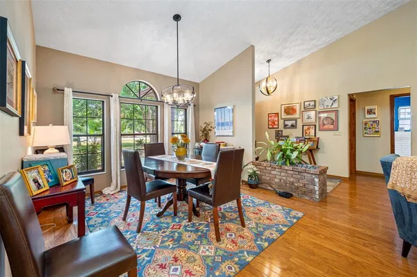 a kitchen with stainless steel appliances granite countertop a stove and cabinets