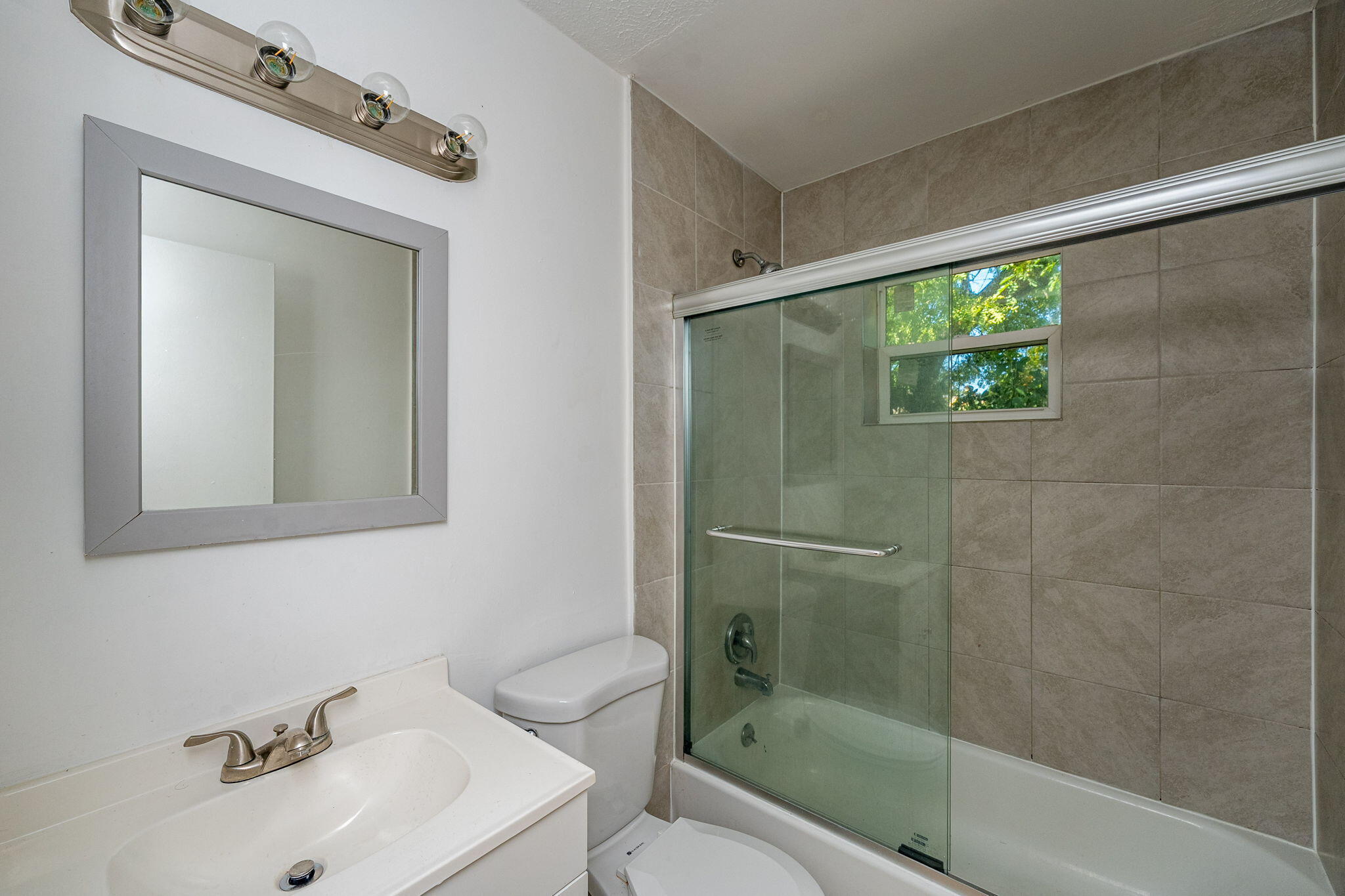 2108 Avenue East Fort Pierce, FL 34950 - Photo 13 of 32 a bathroom with a sink toilet and shower