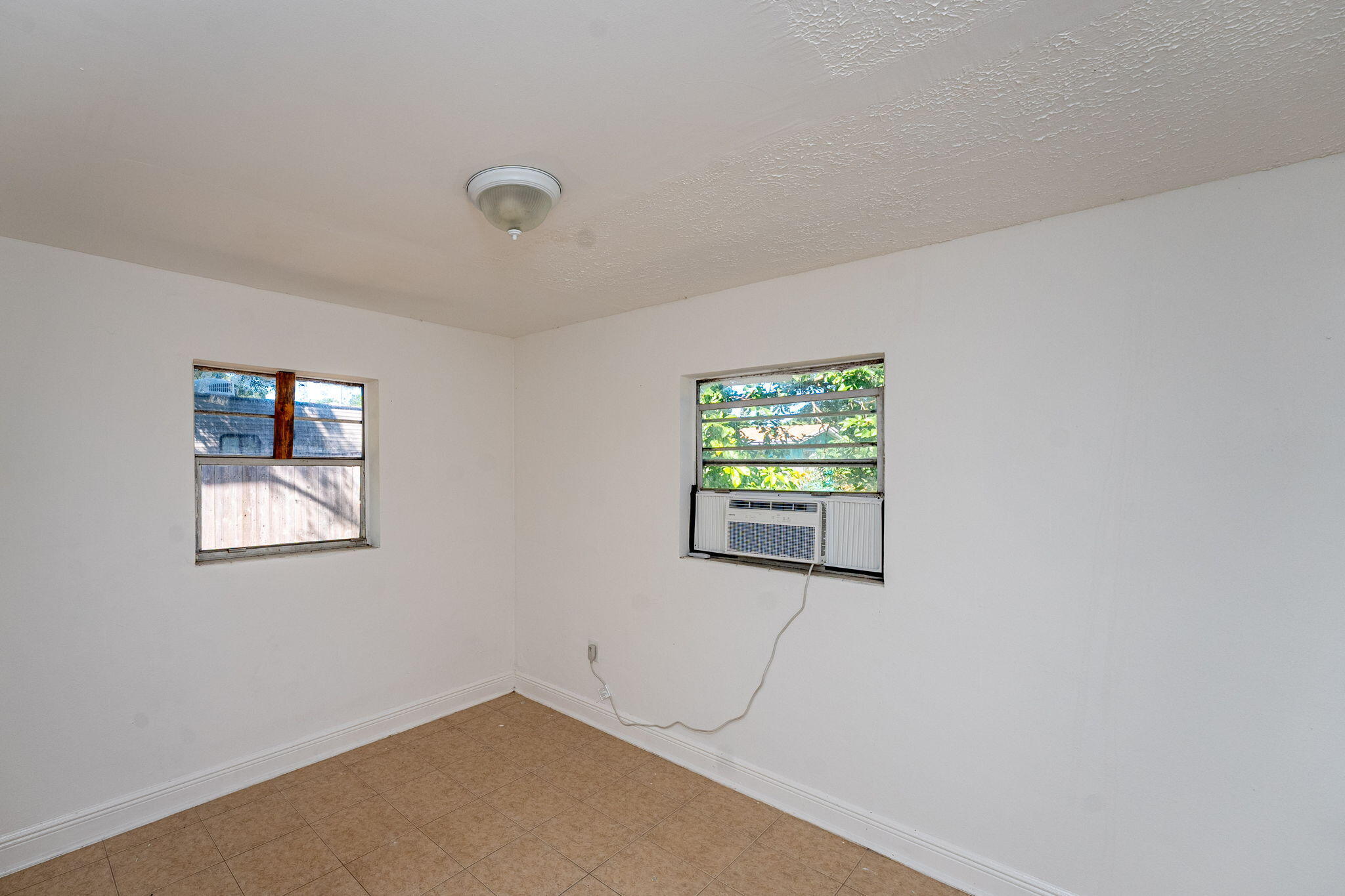 2108 Avenue East Fort Pierce, FL 34950 - Photo 14 of 32 a view of empty room with windows