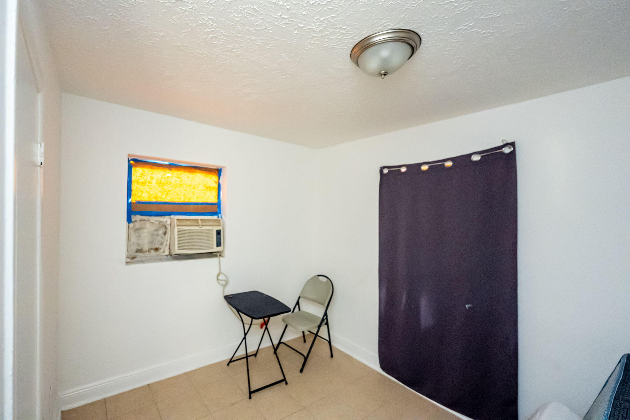 2108 Avenue East Fort Pierce, FL 34950 - Photo 15 of 32 a view of a livingroom with chairs and window