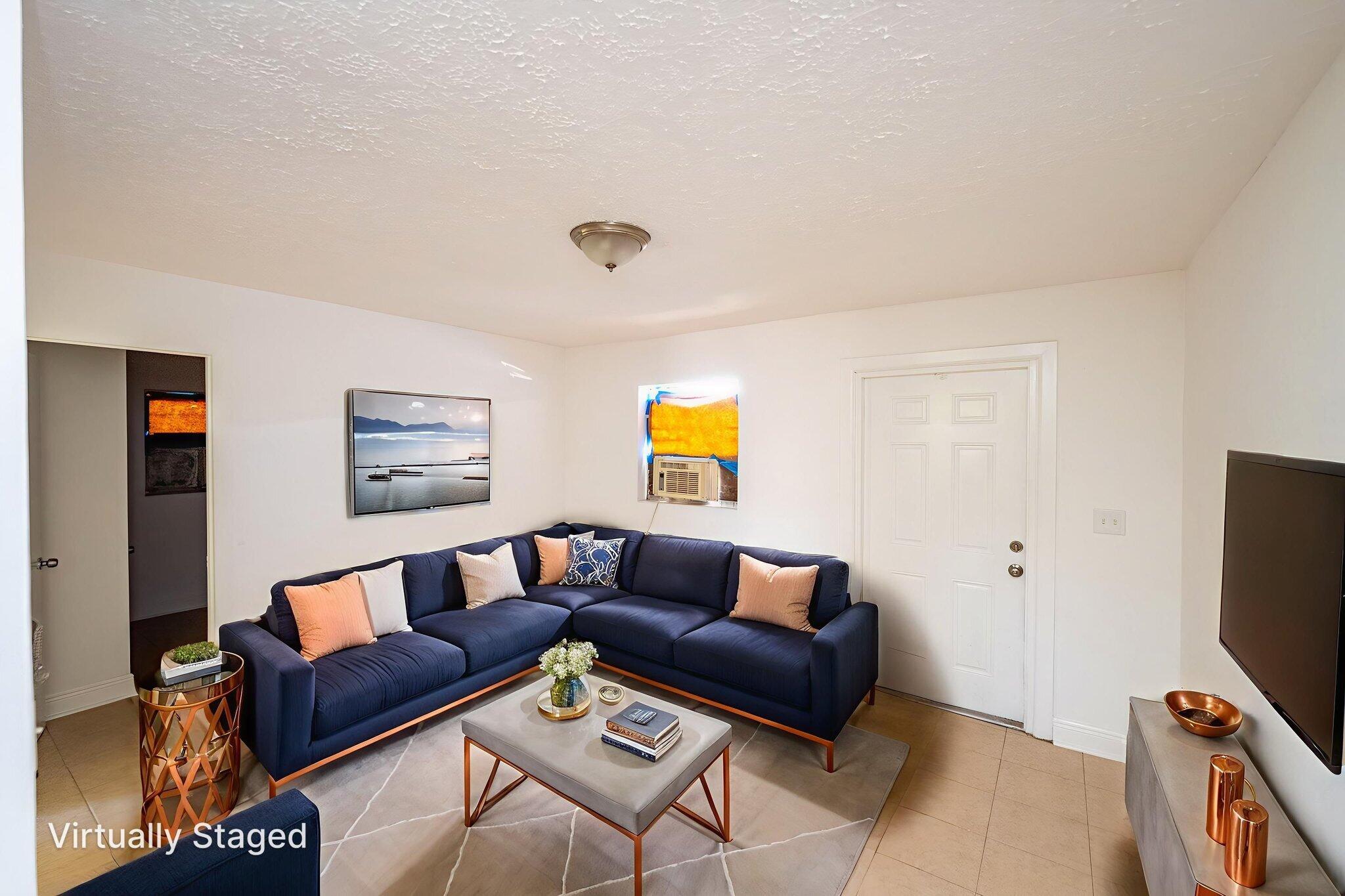 2108 Avenue East Fort Pierce, FL 34950 - Photo 16 of 32 a living room with furniture and a flat screen tv