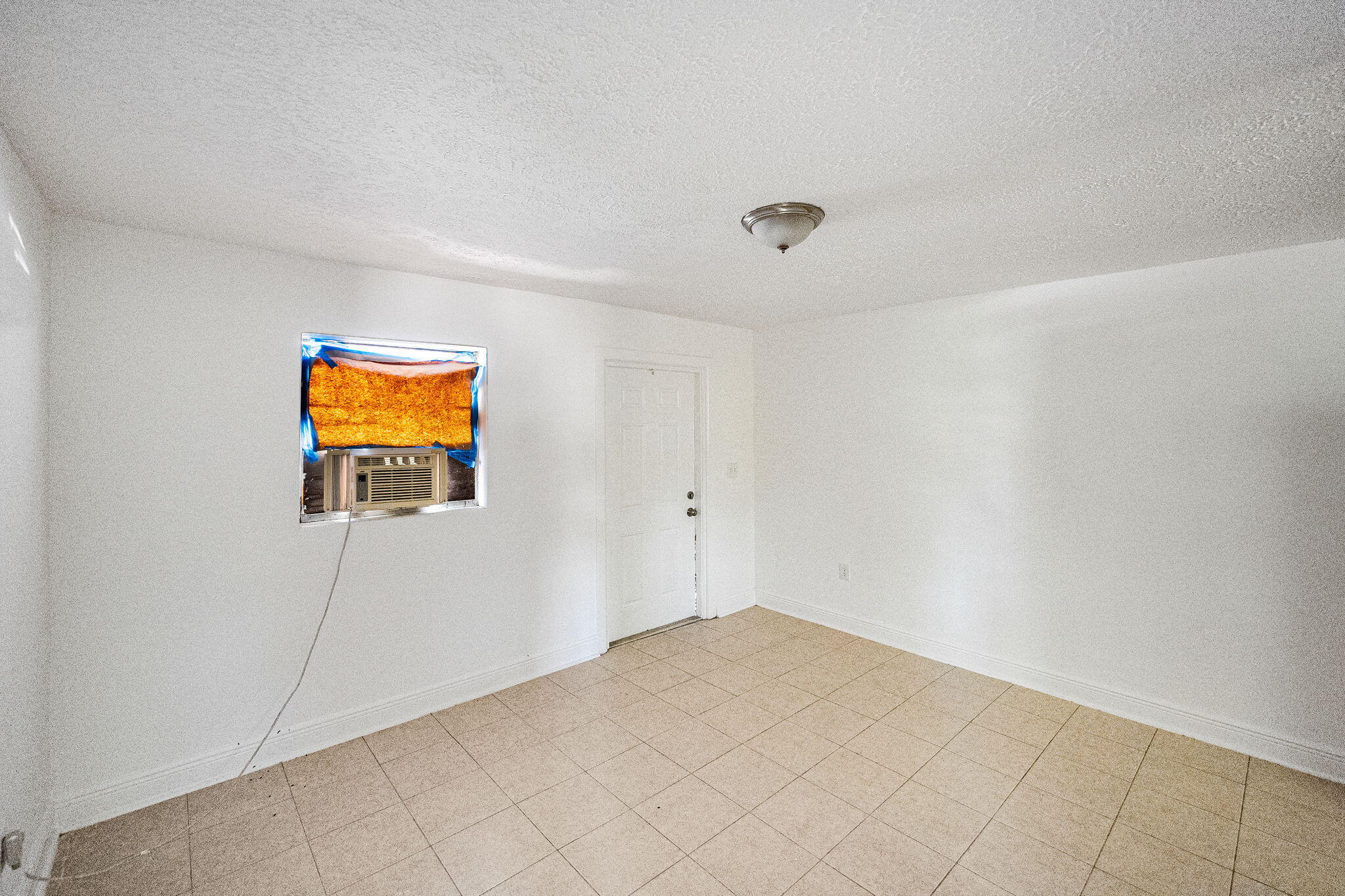 2108 Avenue East Fort Pierce, FL 34950 - Photo 18 of 32 a view of a room with wooden floor and fan