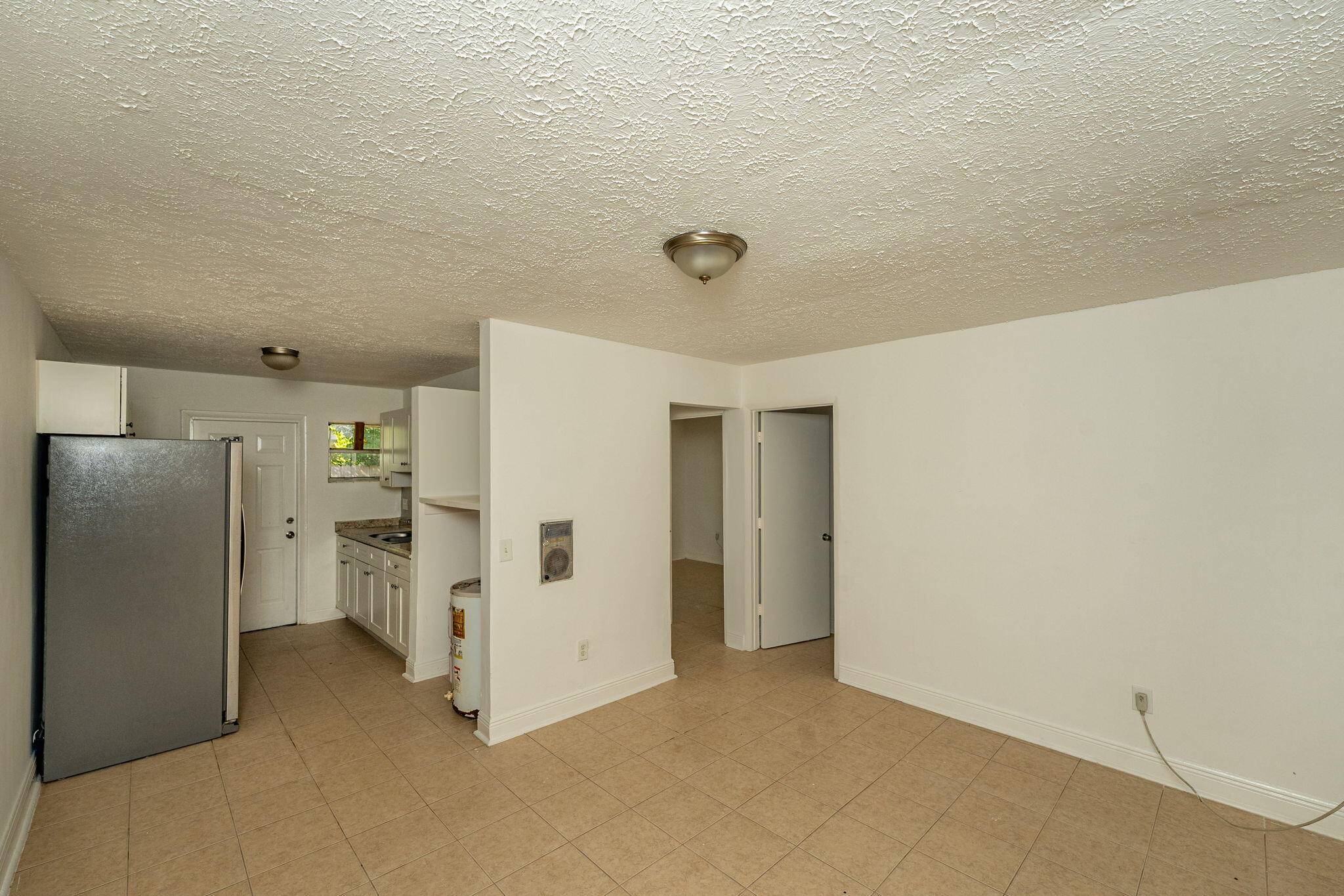 2108 Avenue East Fort Pierce, FL 34950 - Photo 5 of 32 a view of a refrigerator in kitchen and interior
