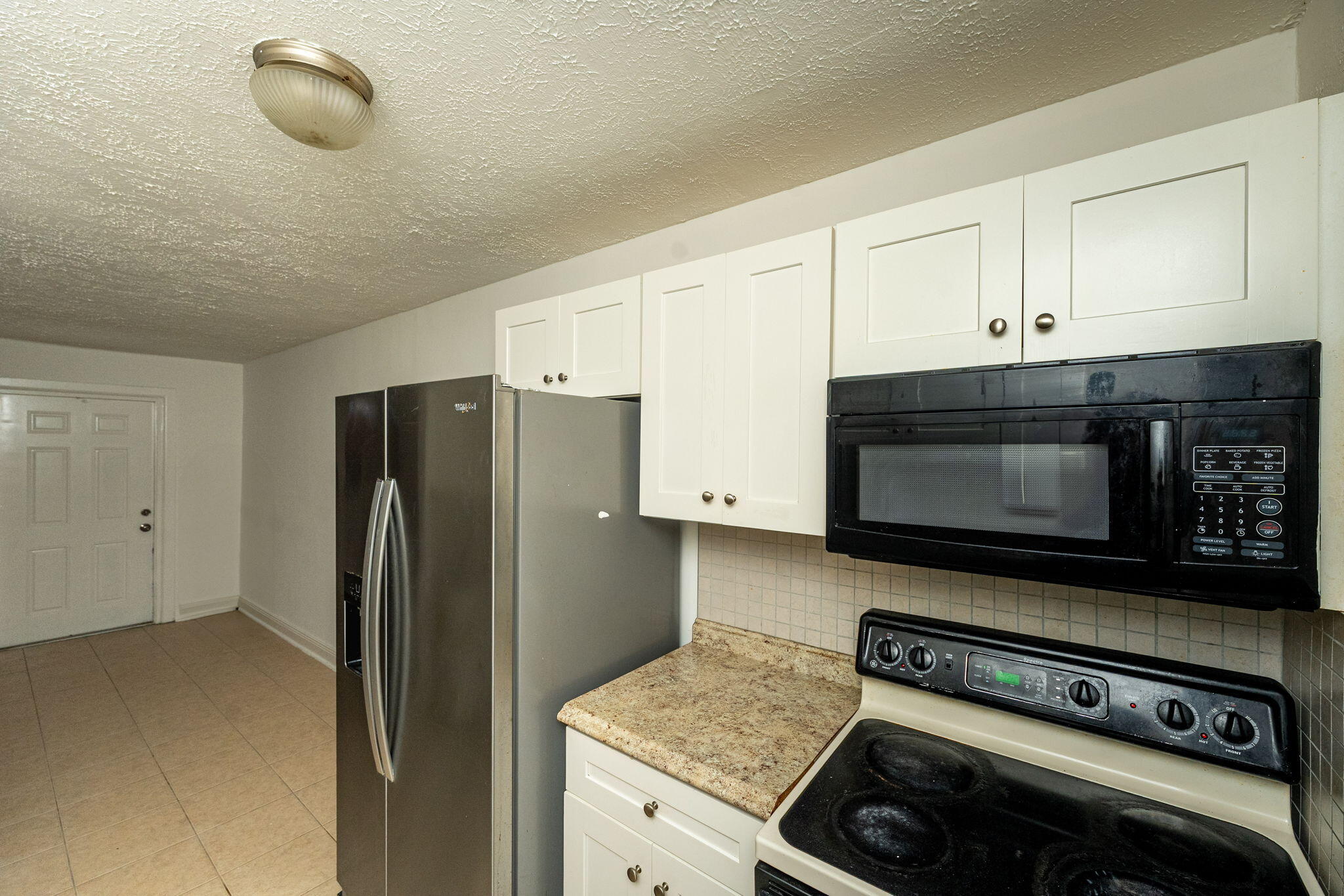 2108 Avenue East Fort Pierce, FL 34950 - Photo 7 of 32 a kitchen with appliances and cabinets