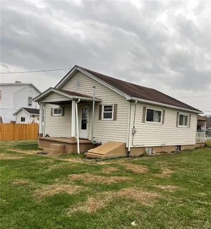 a kitchen with stainless steel appliances kitchen island granite countertop a refrigerator and a stove