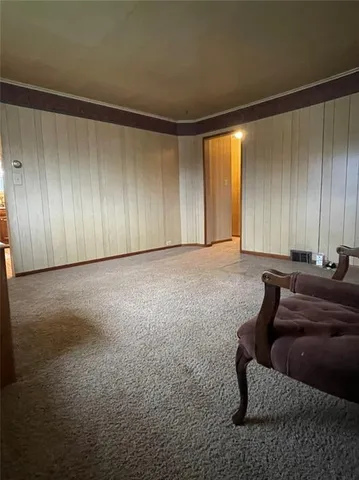 a view of a livingroom with furniture and window