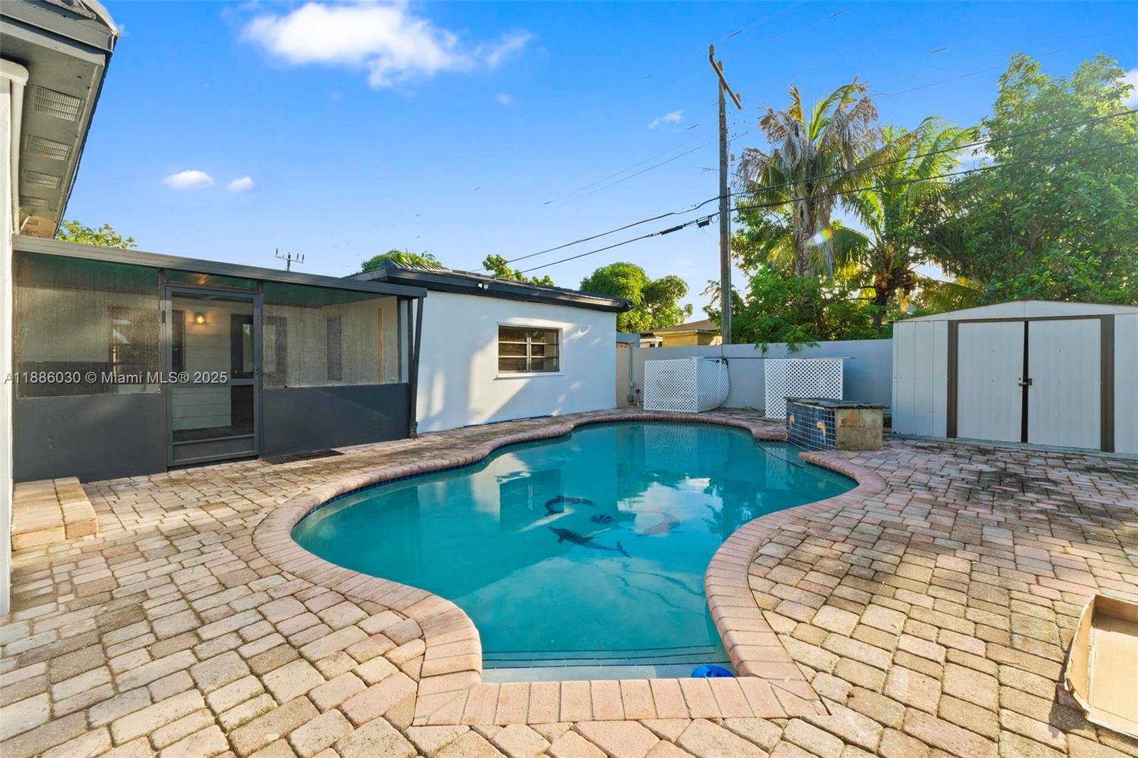 705 East 9th Lane Hialeah, FL 33010 - Photo 16 of 37 a swimming pool with yard