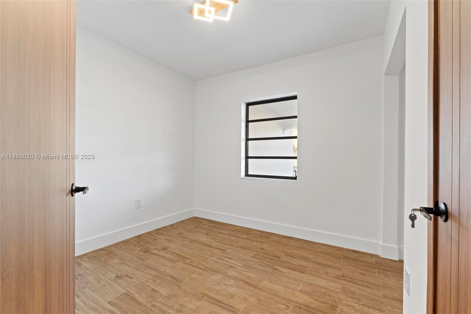 705 East 9th Lane Hialeah, FL 33010 - Photo 29 of 37 wooden floor in an empty room