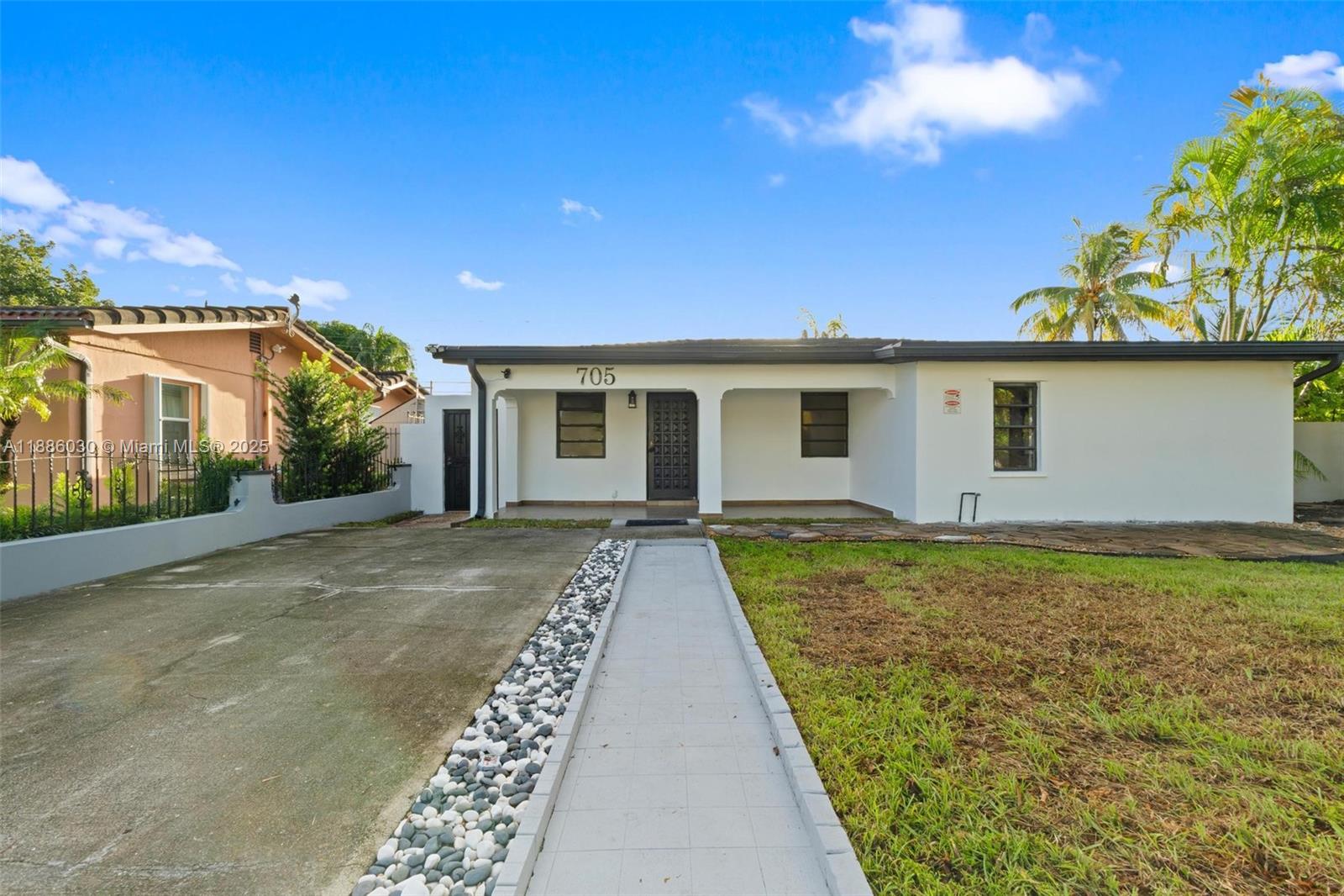 705 East 9th Lane Hialeah, FL 33010 - Photo 3 of 37 a view of a house with backyard and garden