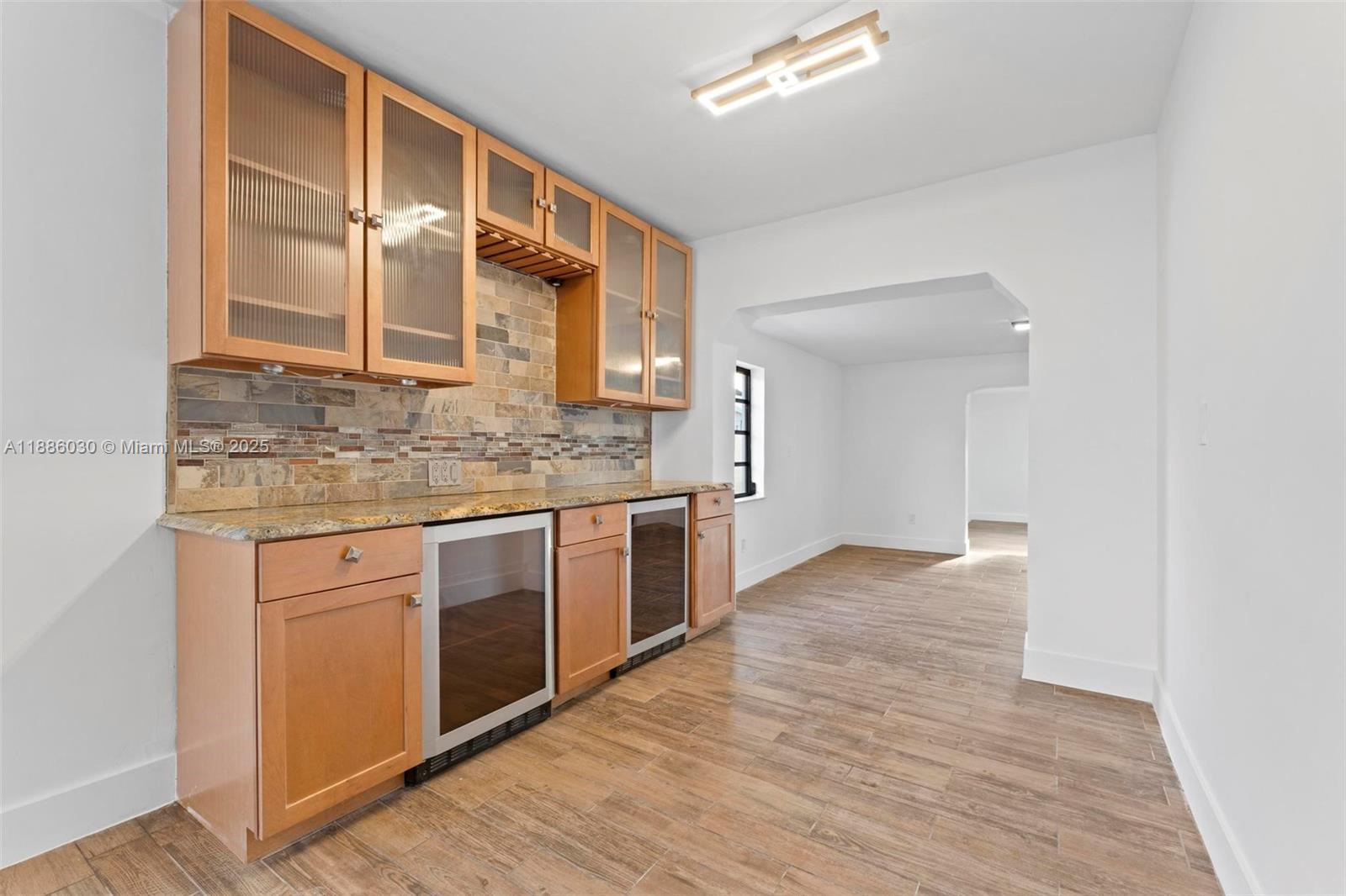 705 East 9th Lane Hialeah, FL 33010 - Photo 7 of 37 a kitchen with stainless steel appliances granite countertop a stove and a sink