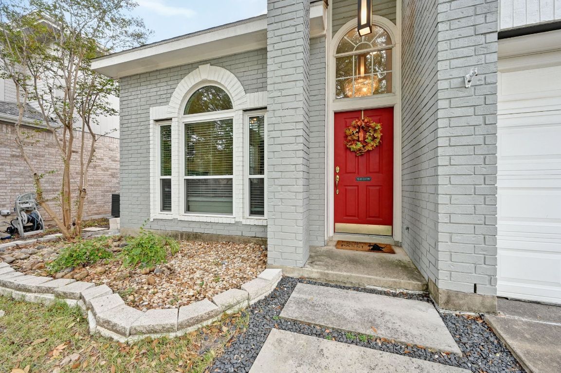 6609 Oasis Drive Austin, TX 78749 - Photo 6 of 27 a front view of a house with a yard
